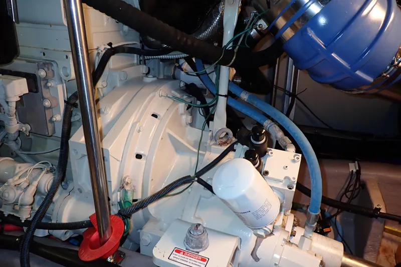 Lattitude Adjustment Yacht Photos Pics Engine compartment of a 2003 Sea Ray 480 Sedan Bridge yacht, showcasing mechanical components.