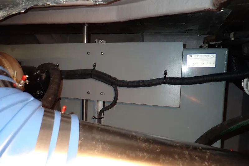 Lattitude Adjustment Yacht Photos Pics Engine compartment of 2003 Sea Ray 480 Sedan Bridge with visible components and wiring.