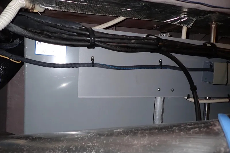 Lattitude Adjustment Yacht Photos Pics Electrical panel and wiring inside a 2003 Sea Ray 480 Sedan Bridge yacht.