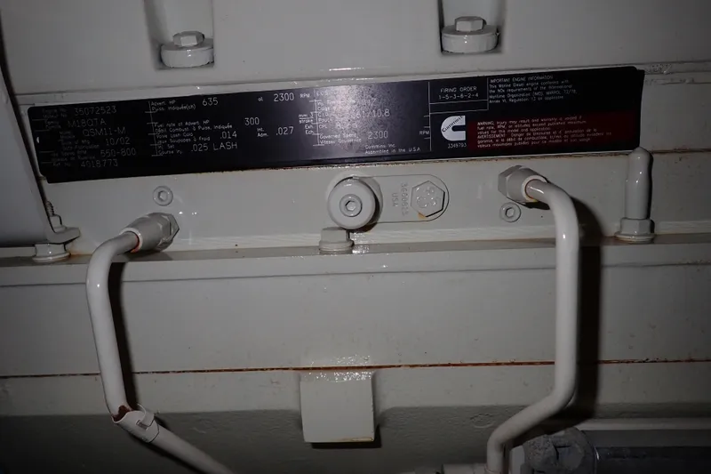 Lattitude Adjustment Yacht Photos Pics Engine compartment of 2003 Sea Ray 480 Sedan Bridge with Cummins label and piping.