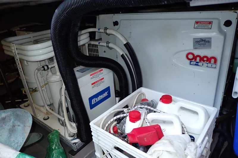 Lattitude Adjustment Yacht Photos Pics Engine room of 2003 Sea Ray 480 Sedan Bridge with Onan generator and Cruisair system.