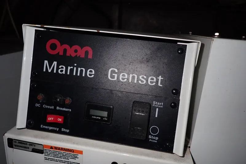 Lattitude Adjustment Yacht Photos Pics Onan Marine Genset control panel on 2003 Sea Ray 480 Sedan Bridge.