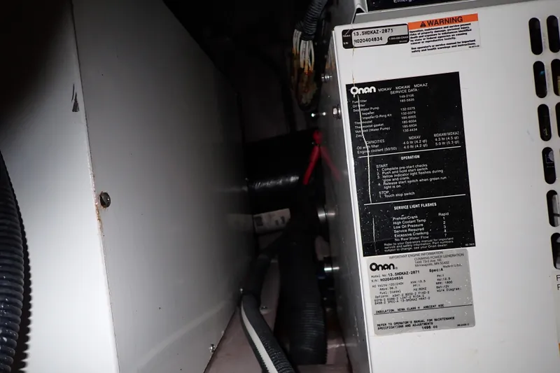 Lattitude Adjustment Yacht Photos Pics Engine compartment of 2003 Sea Ray 480 Sedan Bridge with Onan generator details.