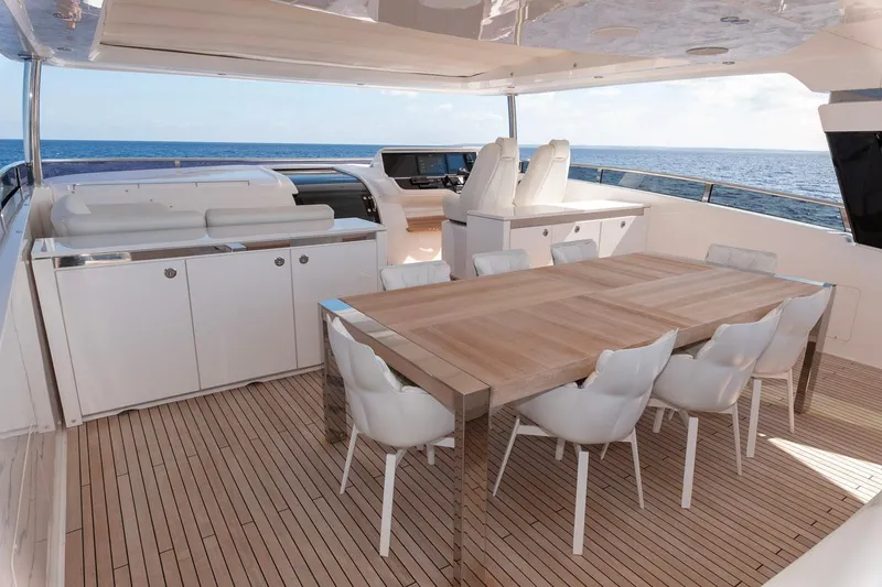 Nadira Yacht Photos Pics Luxurious 2019 Princess 30M yacht deck with dining area and ocean view.
