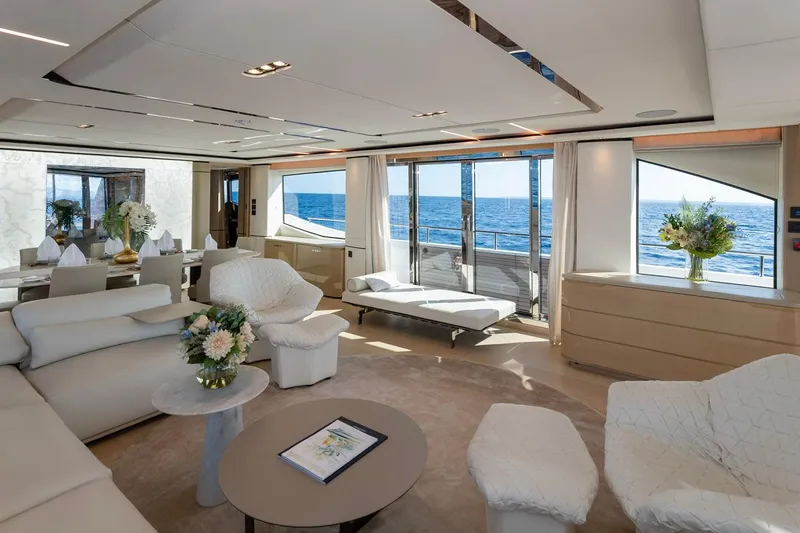 Nadira Yacht Photos Pics Luxurious interior of 2019 Princess 30M yacht with ocean view, elegant seating, and floral decor.