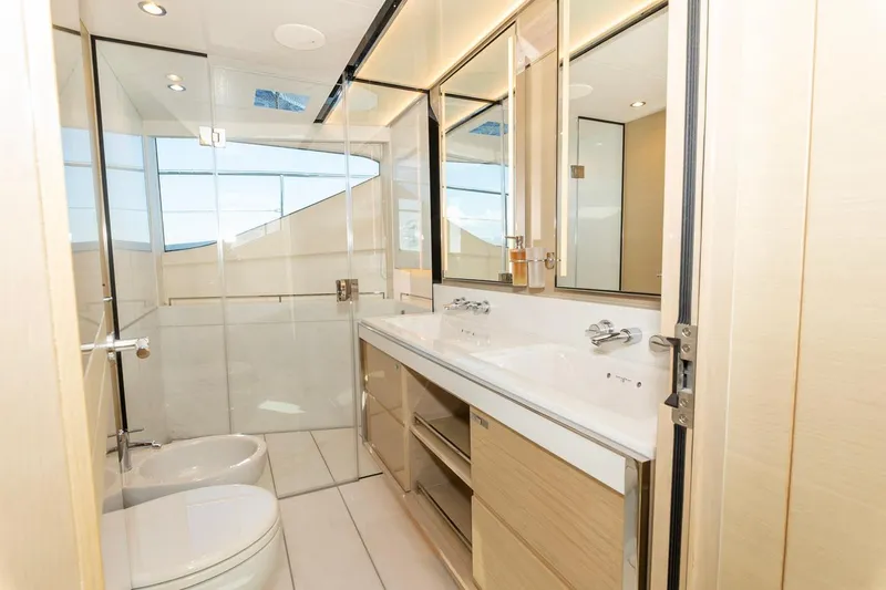 Nadira Yacht Photos Pics Luxurious bathroom interior on a 2019 Princess 30M yacht, featuring modern fixtures and ample lighting.
