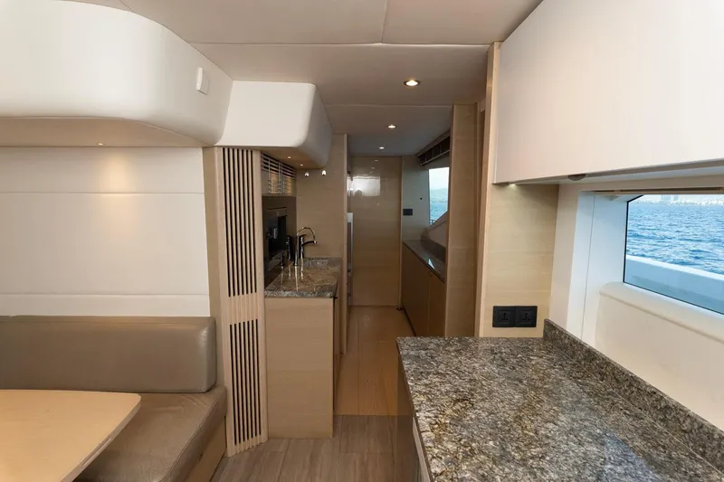 Nadira Yacht Photos Pics Luxurious interior of 2019 Princess 30M yacht with modern kitchen and ocean view.