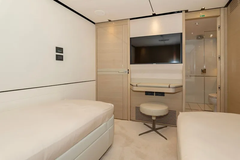 Nadira Yacht Photos Pics Luxurious cabin interior of 2019 Princess 30M yacht with modern amenities and elegant design.