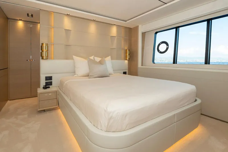 Nadira Yacht Photos Pics Luxurious bedroom interior on 2019 Princess 30M yacht with modern design and ocean view.