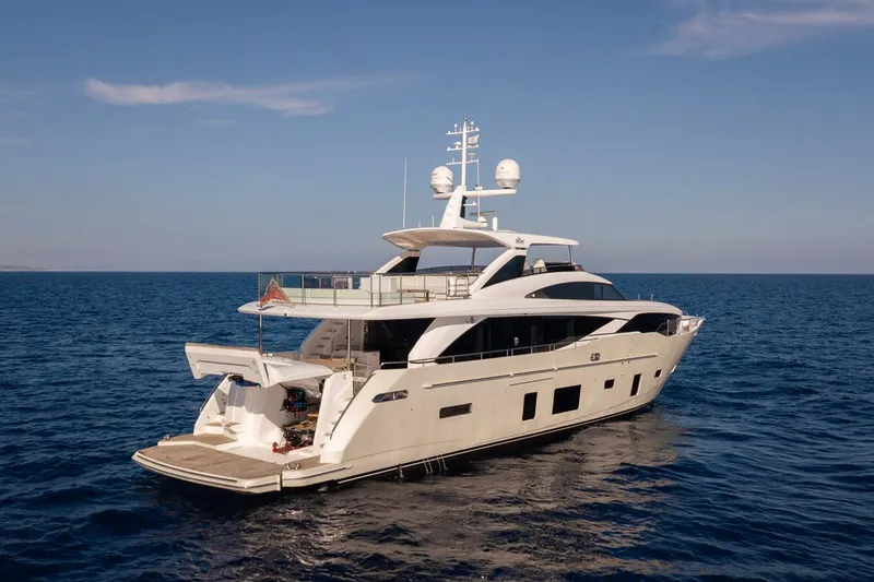 Nadira Yacht Photos Pics Luxurious 2019 Princess 30M yacht cruising on open sea under clear skies.