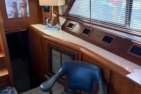  Yacht Photos Pics Interior of 1990 Carver Californian 52 yacht with wooden decor and nautical accents.