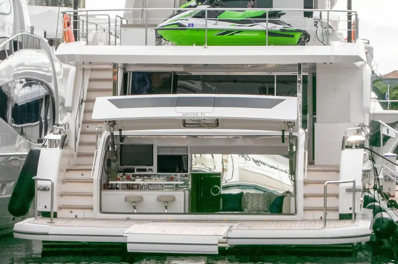 One More Time Yacht Photos Pics Luxury Horizon FD92 yacht with open deck and green jet ski, 2021 model.