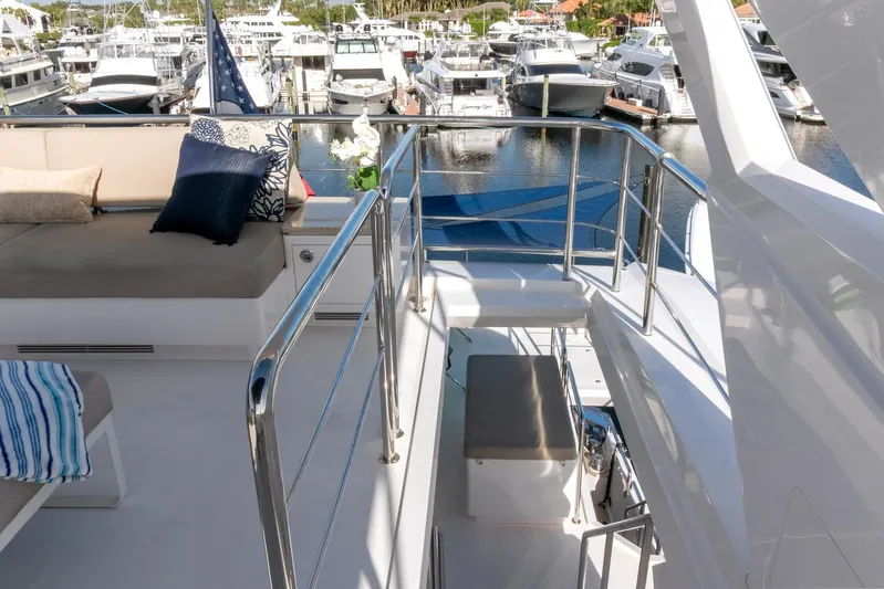 One More Time Yacht Photos Pics Luxurious Horizon FD92 yacht deck with marina view, featuring comfortable seating, 2021 model.
