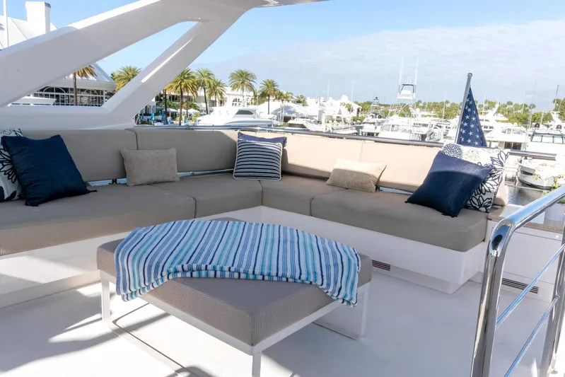 One More Time Yacht Photos Pics Luxurious Horizon FD92 yacht deck with comfortable seating and scenic marina view.