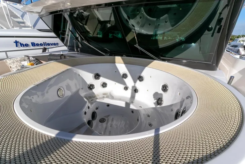 One More Time Yacht Photos Pics Luxurious hot tub on 2021 Horizon FD92 yacht deck.