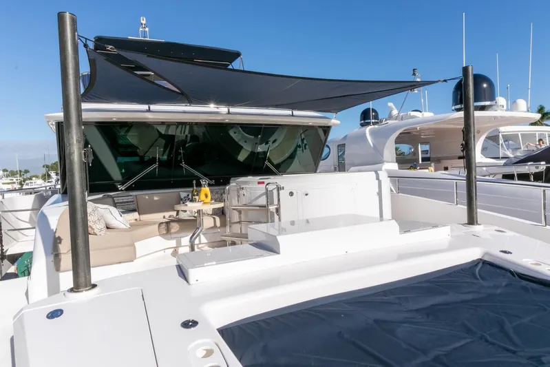 One More Time Yacht Photos Pics Luxury Horizon FD92 yacht deck with sunshade, modern seating, and clear blue sky, 2021 model.