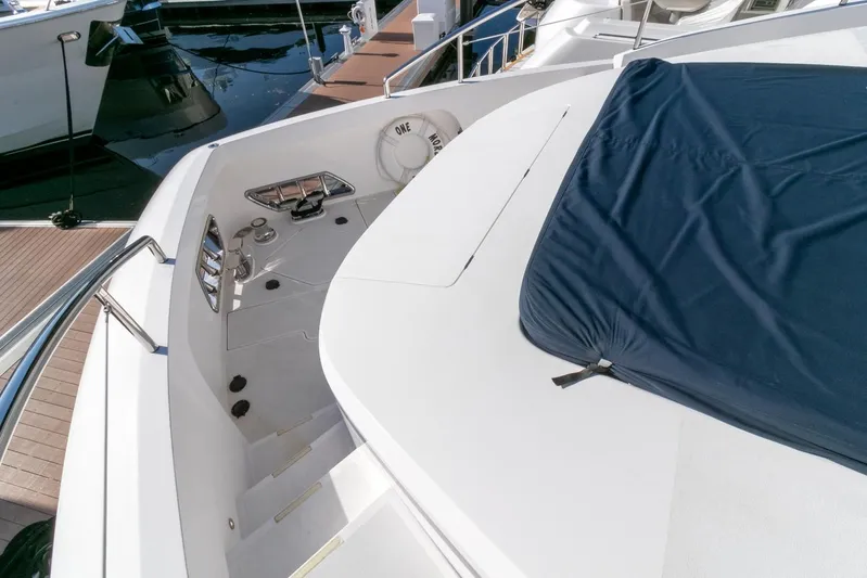 One More Time Yacht Photos Pics Horizon FD92 yacht deck, 2021 model, featuring sleek design and covered seating area.