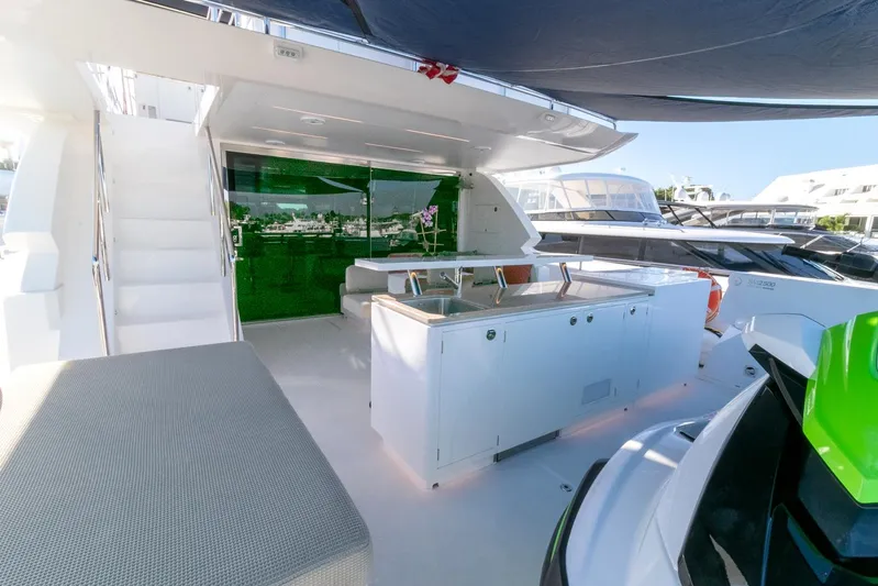 One More Time Yacht Photos Pics Luxurious Horizon FD92 yacht deck with modern outdoor kitchen, 2021 model.