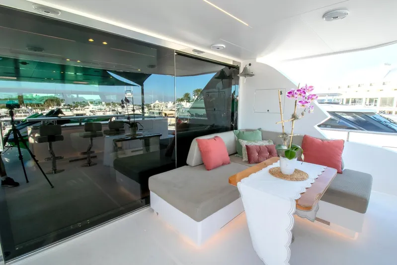 One More Time Yacht Photos Pics Luxurious Horizon FD92 yacht interior with elegant seating and vibrant decor, 2021 model.
