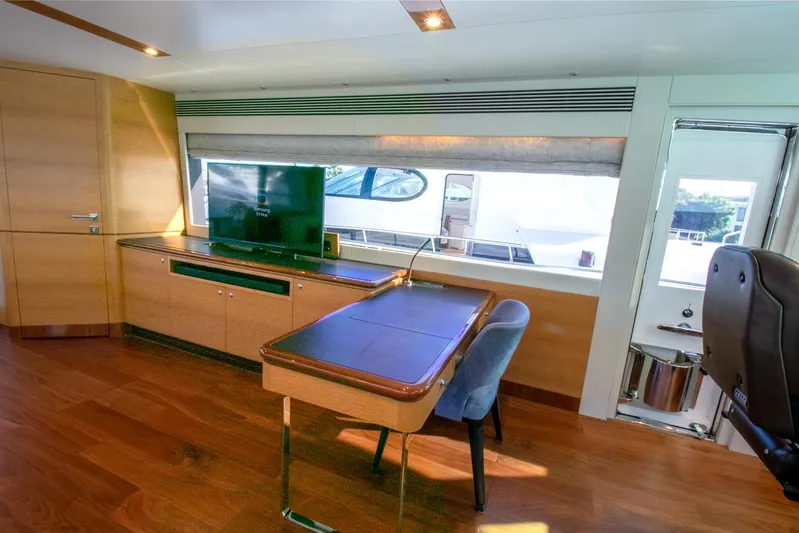 One More Time Yacht Photos Pics Luxurious Horizon FD92 yacht interior with modern desk, chair, and large window view, 2021 model.