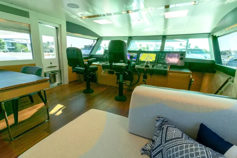 One More Time Yacht Photos Pics Luxurious Horizon FD92 yacht interior with modern helm and seating, 2021 model.
