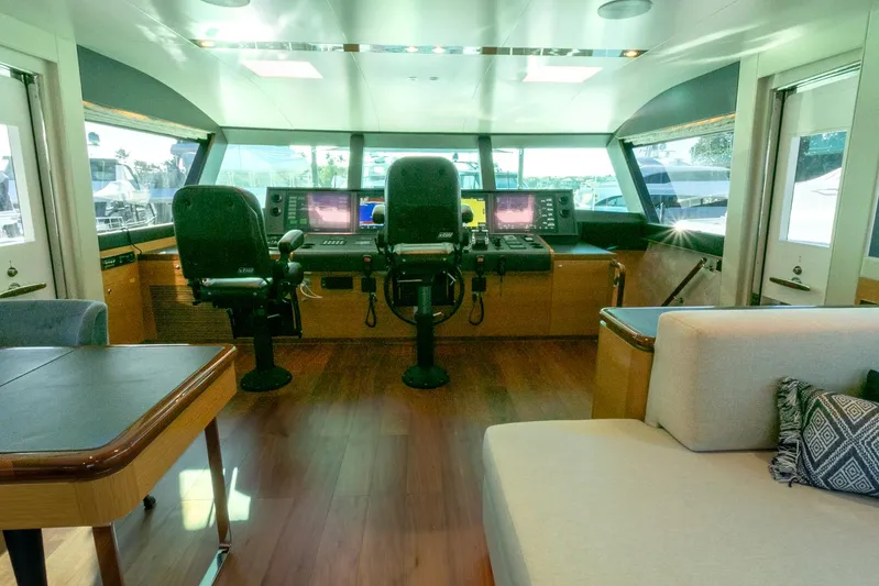 One More Time Yacht Photos Pics Luxurious Horizon FD92 yacht interior with modern helm and seating, 2021 model.