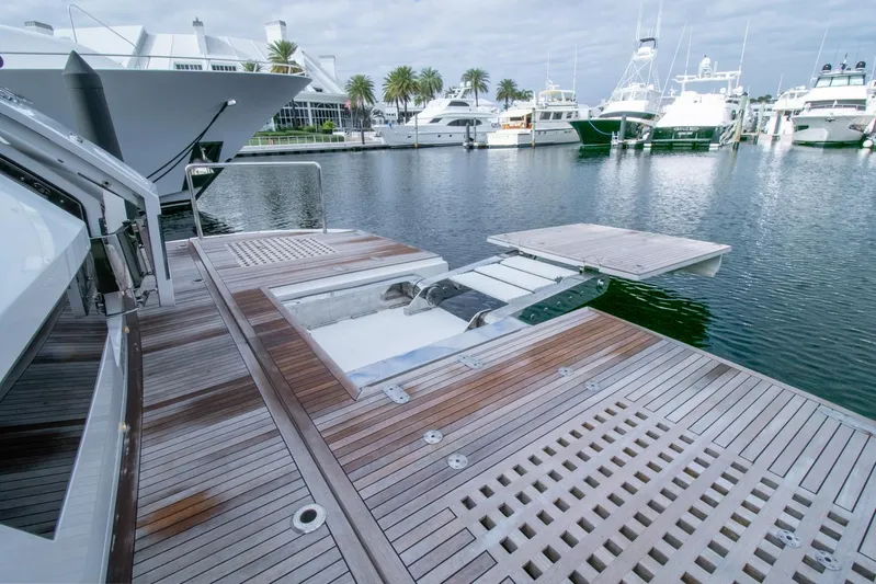 One More Time Yacht Photos Pics Luxury yacht Horizon FD92 2021 with spacious wooden deck in marina.