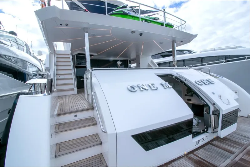 One More Time Yacht Photos Pics Luxury Horizon FD92 yacht, 2021 model, docked with open rear deck and stairs.