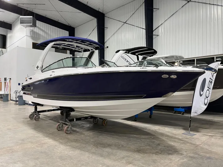  Yacht Photos Pics 2023 Monterey 298 Super Sport boat displayed indoors on stands.