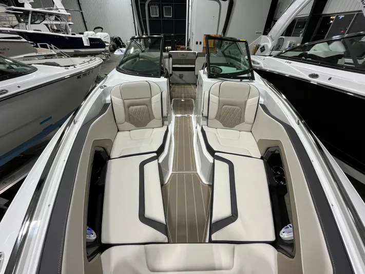  Yacht Photos Pics 2023 Monterey 298 Super Sport boat interior with luxurious seating and sleek design.