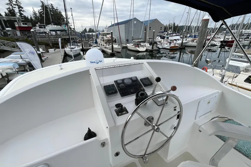 Abina Yacht Photos Pics Kadey-Krogen 39 yacht helm, 2001 model, docked in a marina with various boats.