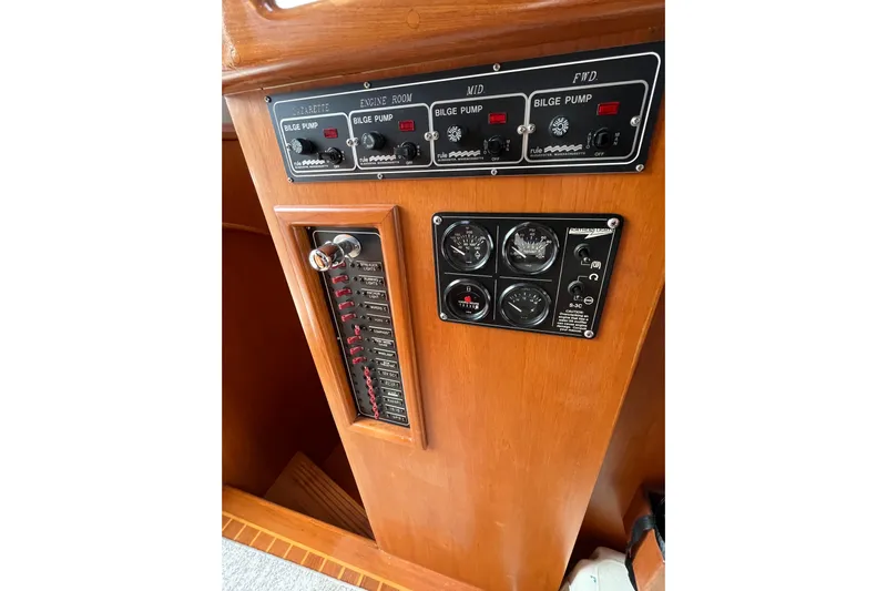 Abina Yacht Photos Pics Control panel of a 2001 Kadey-Krogen 39 boat with gauges and switches.