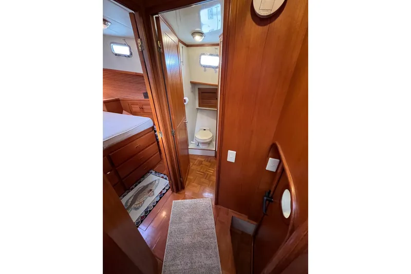 Abina Yacht Photos Pics 2001 Kadey-Krogen 39 interior with wooden finish, showing bedroom and bathroom.