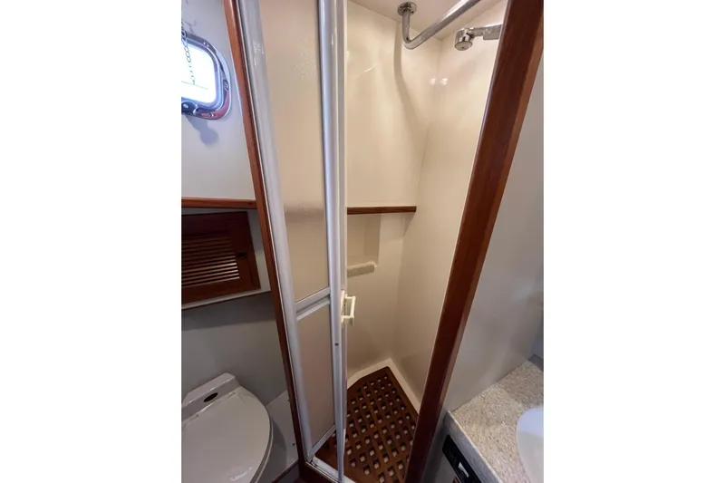 Abina Yacht Photos Pics Bathroom interior of 2001 Kadey-Krogen 39 yacht with shower and toilet.