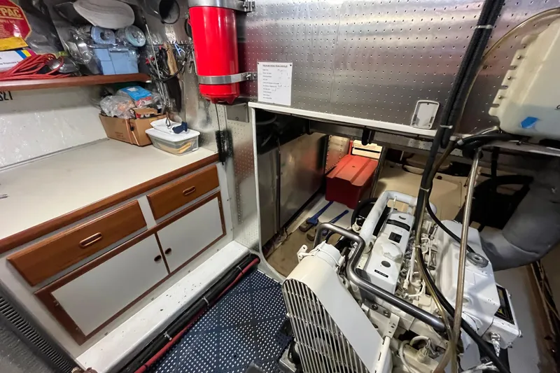 Abina Yacht Photos Pics Engine room of 2001 Kadey-Krogen 39 yacht with storage and equipment.