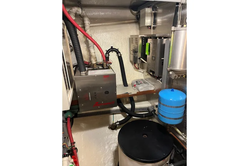 Abina Yacht Photos Pics Engine room of 2001 Kadey-Krogen 39 yacht with mechanical equipment and wiring.