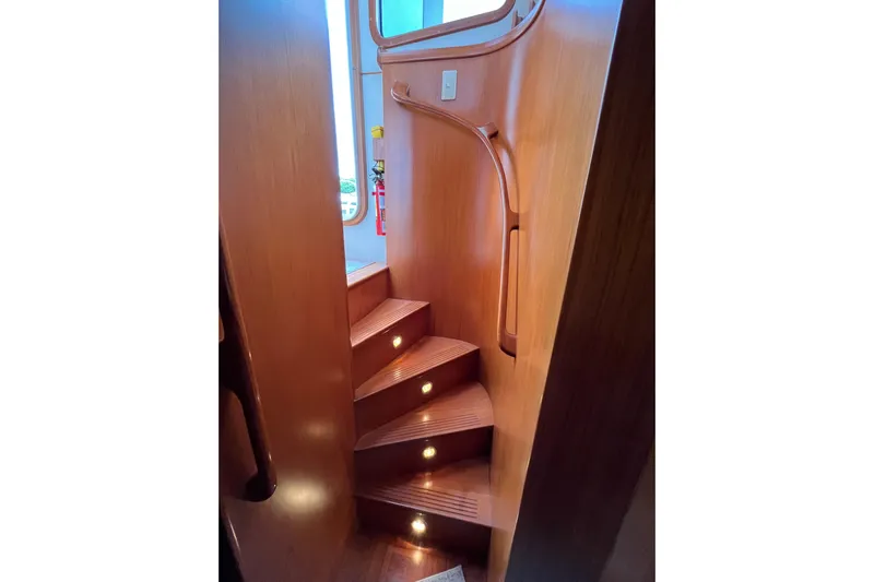 Abina Yacht Photos Pics Wooden staircase with built-in lights on a 2001 Kadey-Krogen 39 yacht.