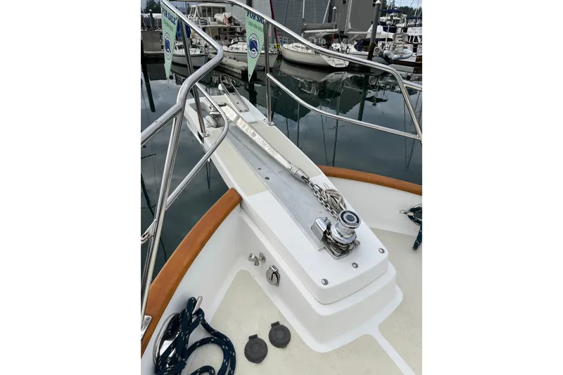 Abina Yacht Photos Pics Bow view of 2001 Kadey-Krogen 39 yacht with anchor chain and winch.