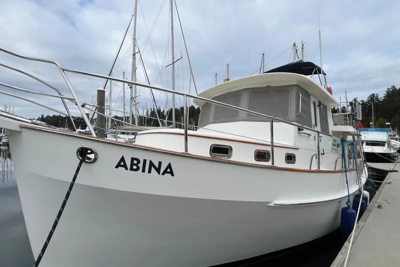 Abina Yacht Photos Pics 2001 Kadey-Krogen 39 boat named "Abina" docked at a marina.