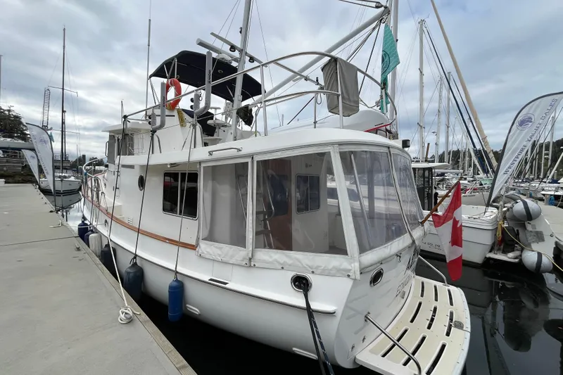 Abina Yacht Photos Pics Kadey-Krogen 39 yacht, 2001 model, docked at marina with Canadian flag.