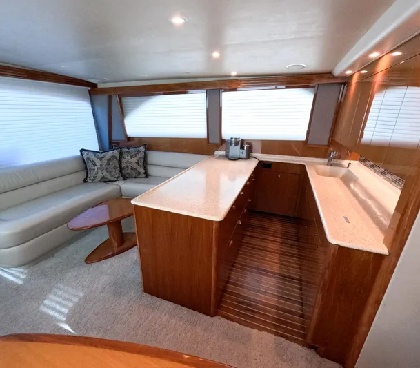 Farmers Daughter Yacht Photos Pics Luxurious interior of 2004 Viking 45 Convertible yacht with modern kitchen and seating area.