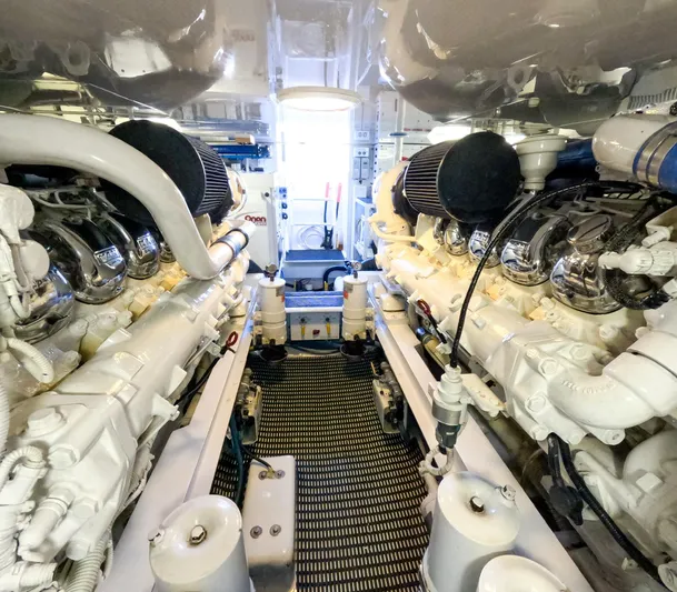 Farmers Daughter Yacht Photos Pics Engine room of 2004 Viking 45 Convertible yacht, showcasing dual engines and mechanical components.