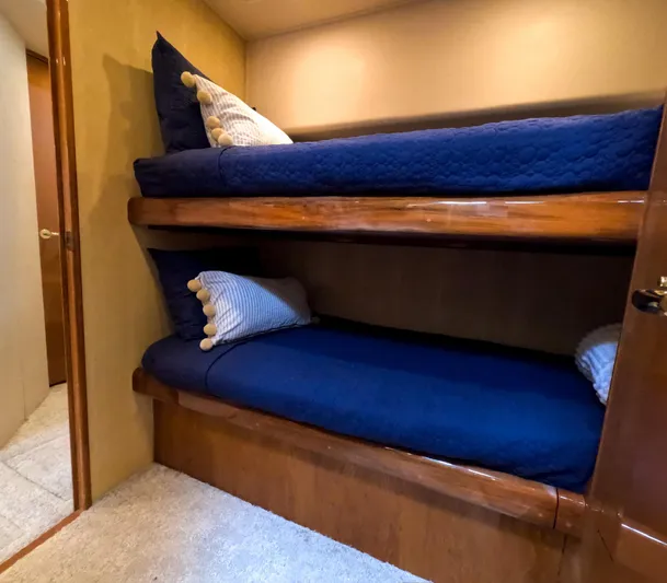 Farmers Daughter Yacht Photos Pics Bunk beds with blue bedding in 2004 Viking 45 Convertible yacht interior.
