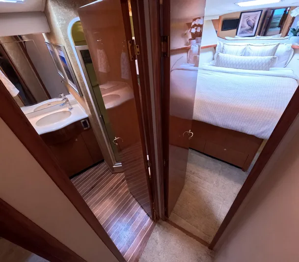 Farmers Daughter Yacht Photos Pics Interior of 2004 Viking 45 Convertible yacht showing bedroom and bathroom.