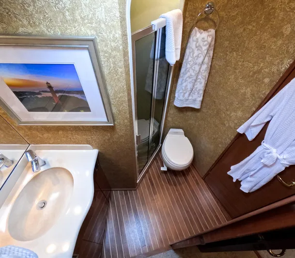 Farmers Daughter Yacht Photos Pics Luxurious bathroom in 2004 Viking 45 Convertible yacht with elegant decor and modern amenities.