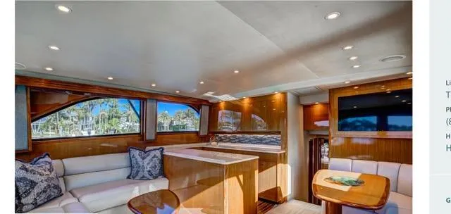 Farmers Daughter Yacht Photos Pics Luxurious interior of 2004 Viking 45 Convertible yacht with elegant seating and wood finishes.