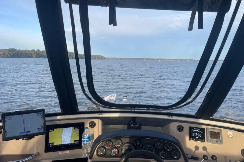 Fire Away Yacht Photos Pics Cockpit view from 2005 Carver 444 Cockpit Motor Yacht on open water.
