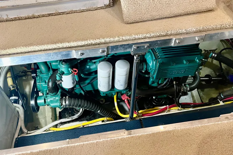 Fire Away Yacht Photos Pics Engine compartment of a 2005 Carver 444 Cockpit Motor Yacht, showcasing mechanical components.