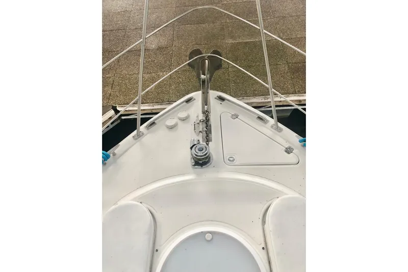 Fire Away Yacht Photos Pics Bow view of 2005 Carver 444 Cockpit Motor Yacht, showcasing deck and anchor system.