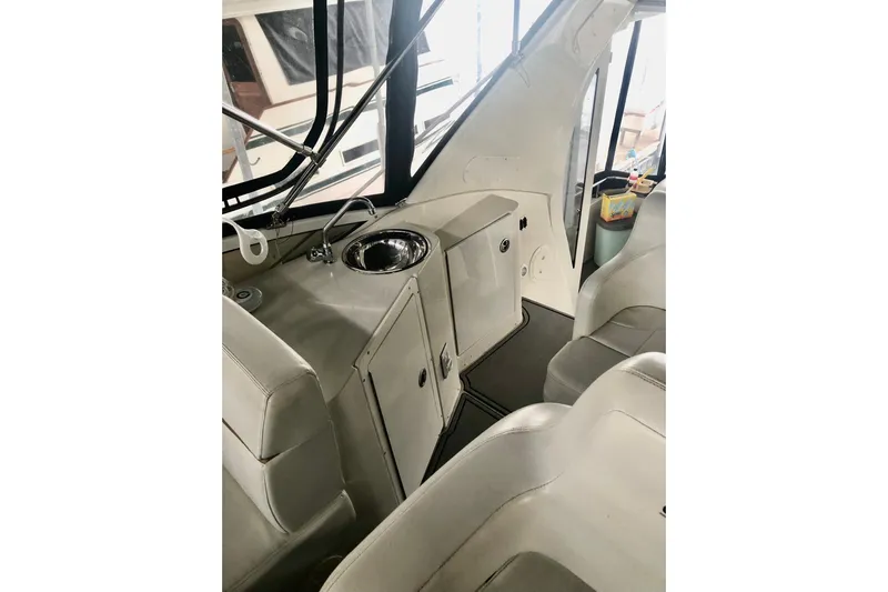 Fire Away Yacht Photos Pics 2005 Carver 444 Cockpit Motor Yacht interior with seating and sink area.